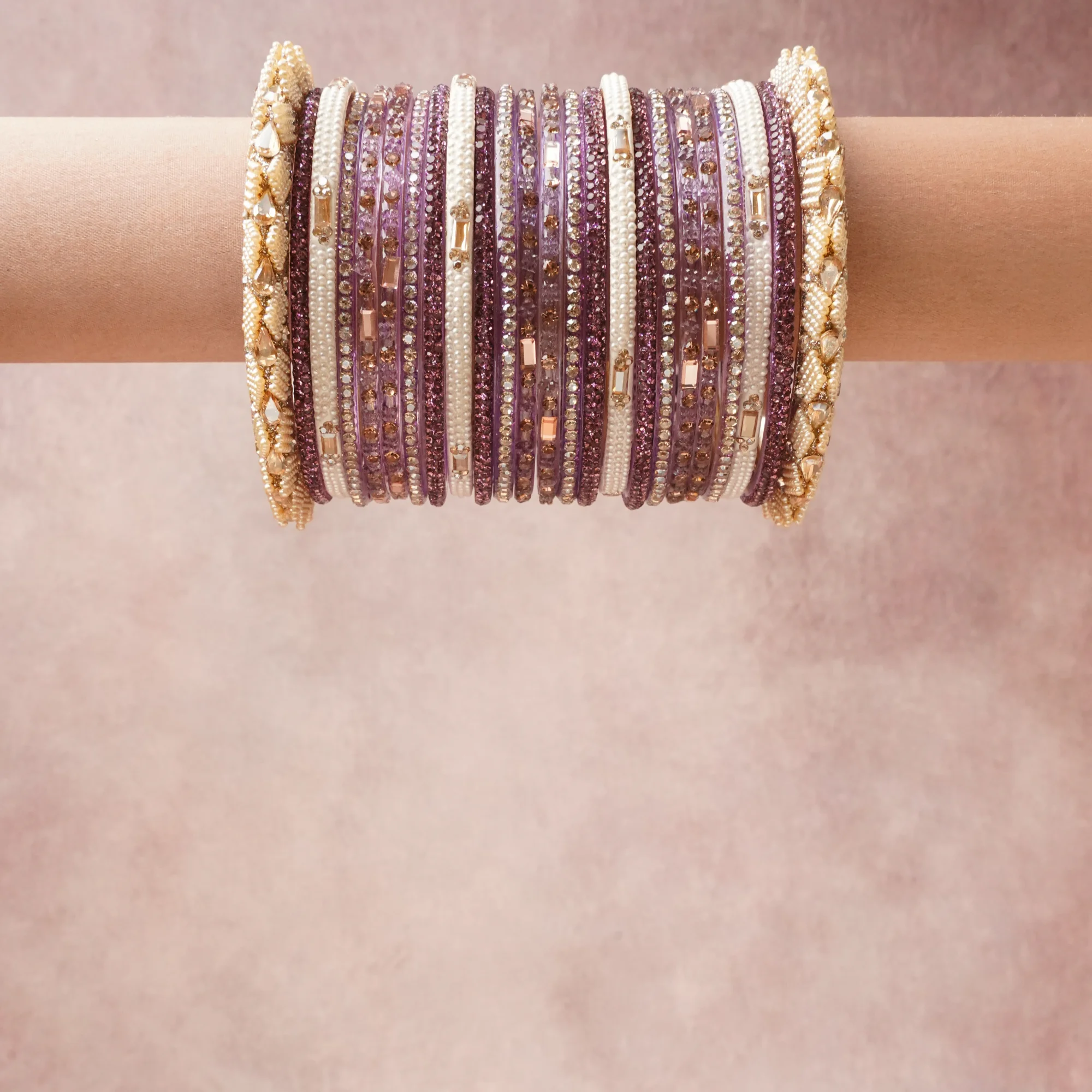 A grounding Lilac forms the heart of the set, while touches of Fuchsia Pink, Rose Gold, Clear Crystal, Pearl White add charm.

A thoughtful composition of Acrylic, Gold-toned Metal, Rhinestones, Faux Pearls, designed to feel complete without being heavy.
Each element layers seamlessly, creating a look that is refined, wearable and quietly striking.